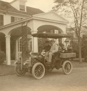 Alfred & Ada Pope in their first automobile, a 1904 Model D White Steamer. Note the chauffeur and the right-hand drive, with the steering wheel on what is now the passenger side.